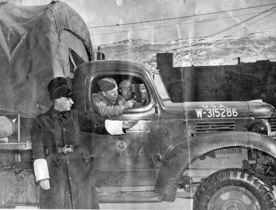 A constable directs the driver of an American truck, 1941 A constable directs the driver of an American truck, 1941