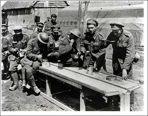 Men of the Newfoundland Regiment Eating their Dinner at Berneville, 9 May 1917